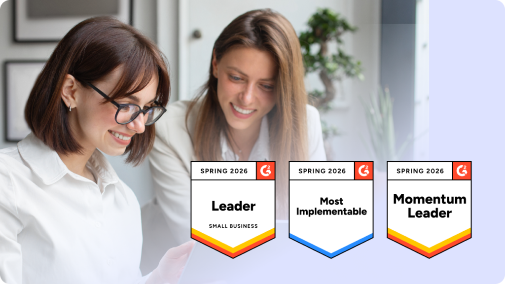 Two women smiling at a laptop, with G2 Spring 2026 badges showing CloudTalk as a G2 Leader in Contact Center Software for Small Businesses.